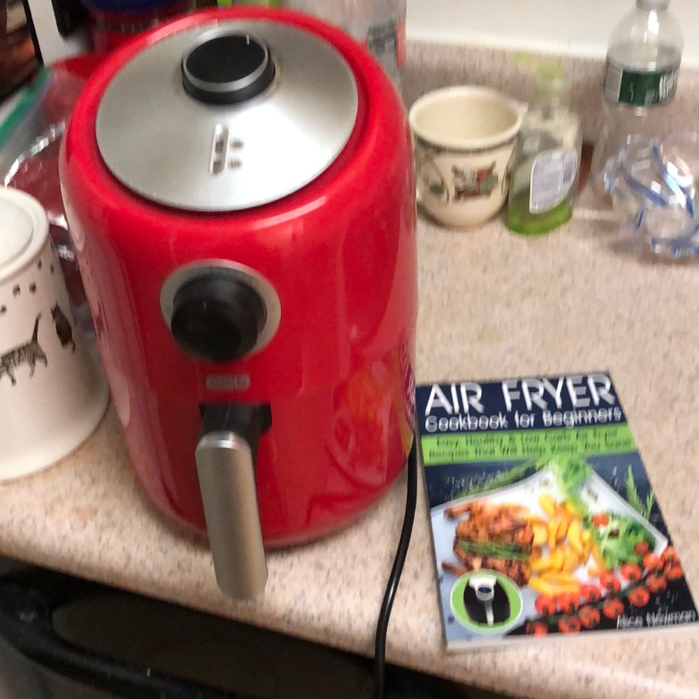 Full-size air fryer with recipe book.  Never used.